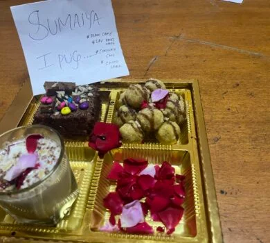 A box of assorted homemade sweets and desserts prepared for the cultural event.