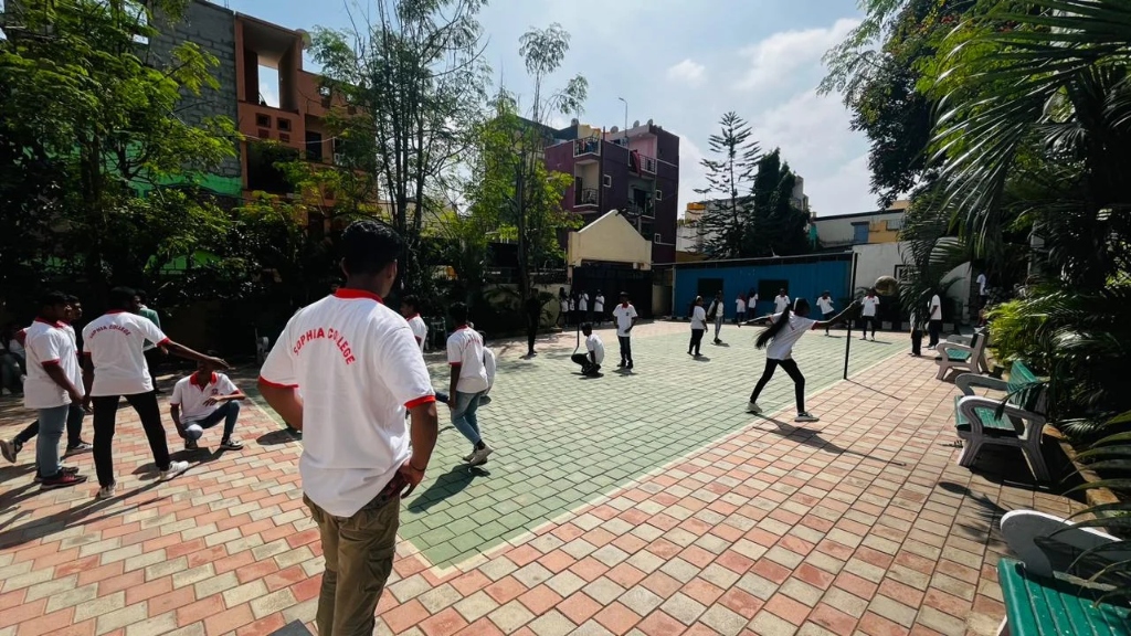 Students engaged in a sports activity on the outdoor court.