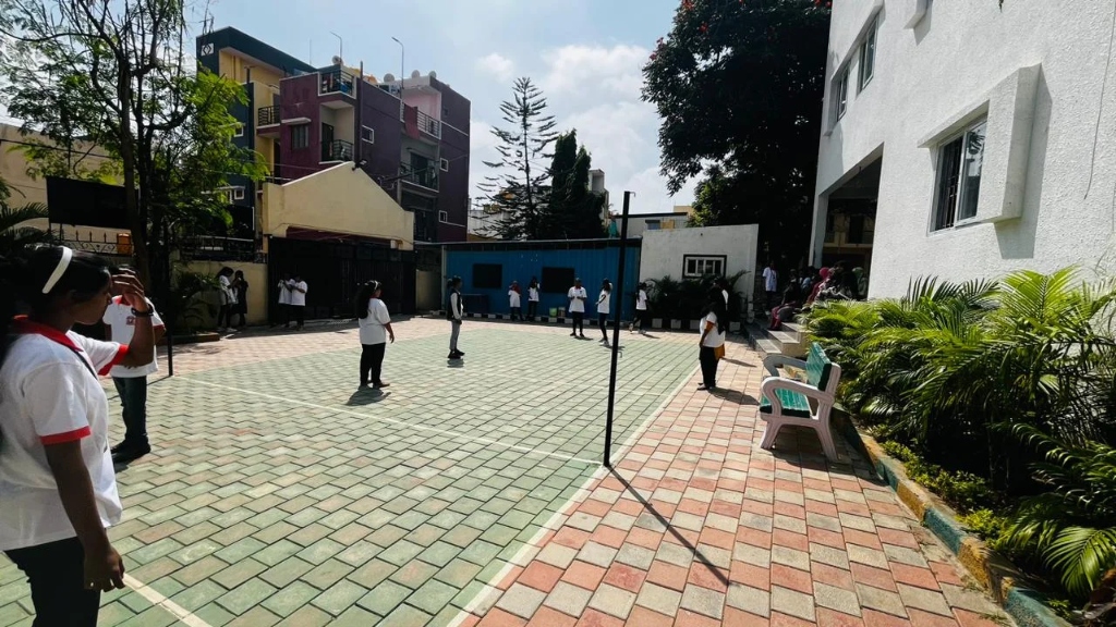 Students gathered around the throwball net during the sports day event.